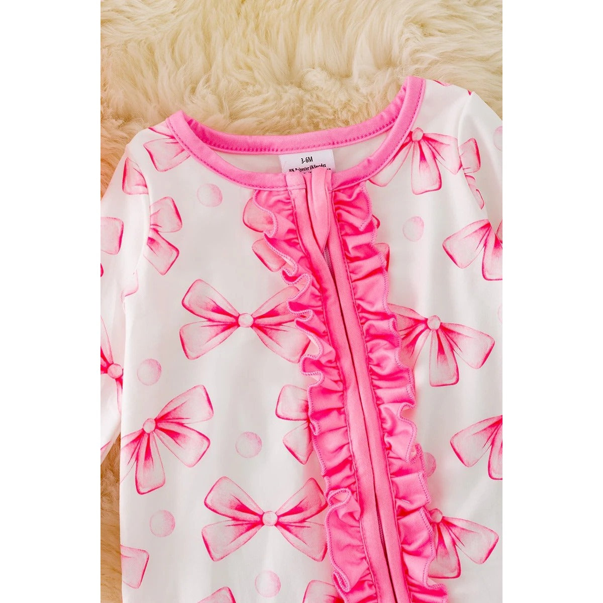 COQUETTE RUFFLE ONESIE W/ZIPPER.