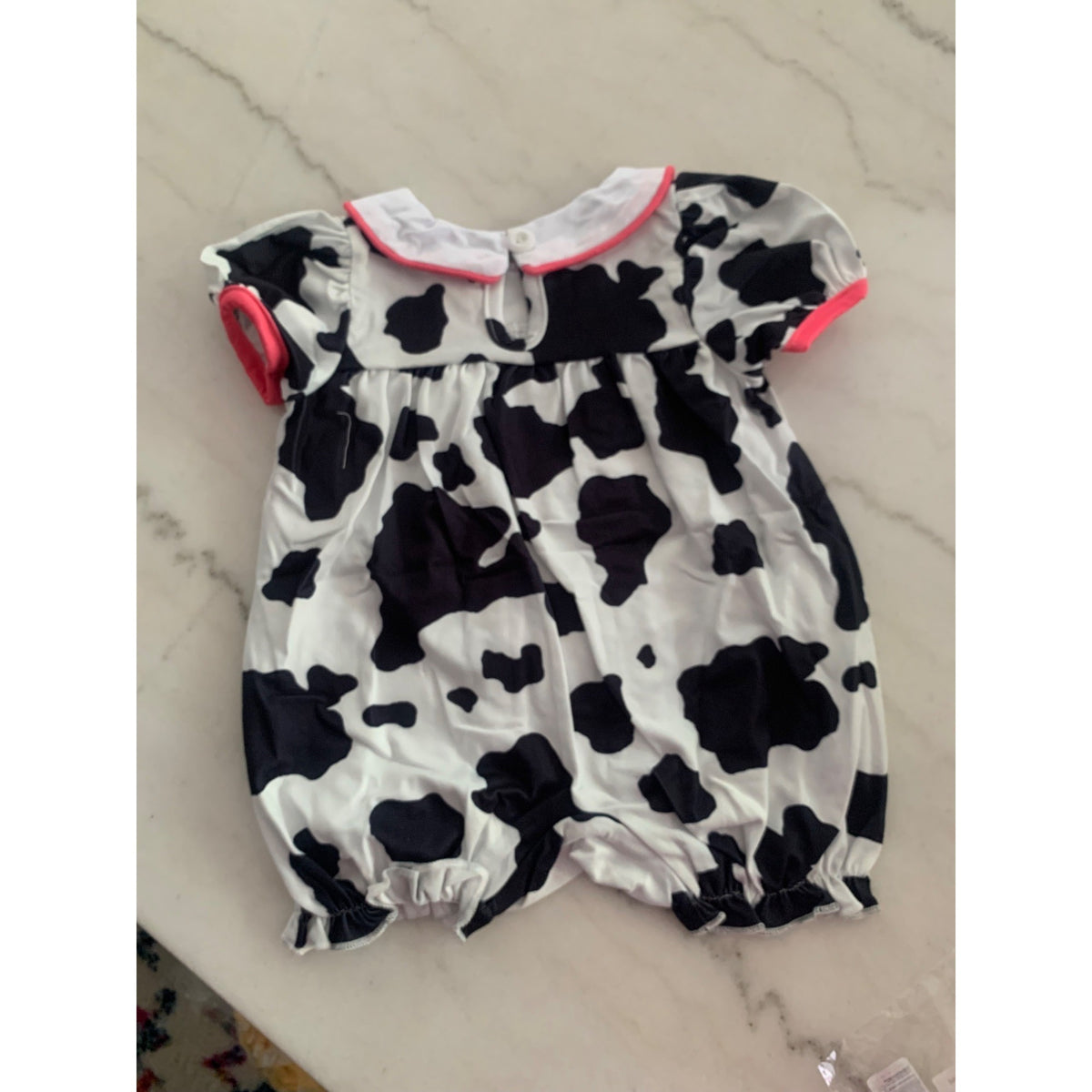Cow Print Baby Romper With Embroidered Cow Faces & Pink Accents